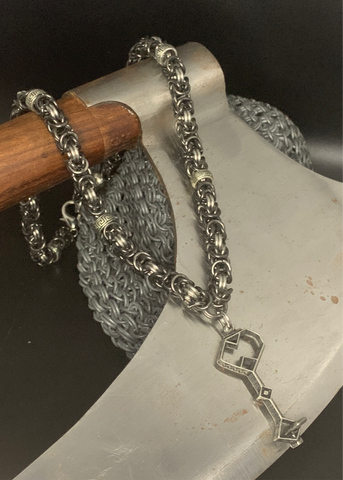 Mysterious Dwarven key on a chainmail necklace.